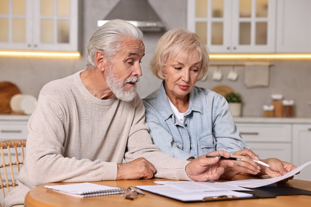 Ontario elderly couple reviewing documents