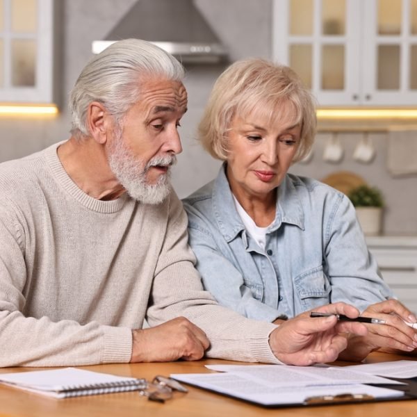 Ontario elderly couple reviewing documents