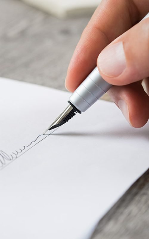Person signing with a pen a Hamilton Ontario Wills Lawyer Will